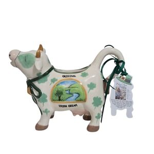 Irish cream ceramic cow creamer. Green and White